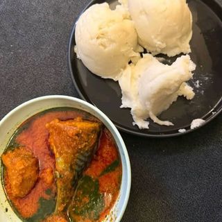 Pounded yam served with ewedu mixed with beef pomo titus fish