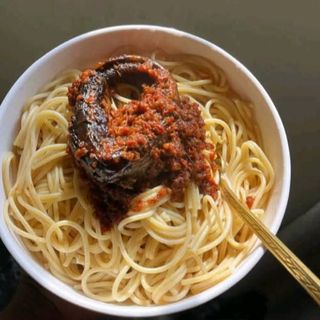 Boiled Sphaghetti served with titus fish in spicy Nigerian sauce