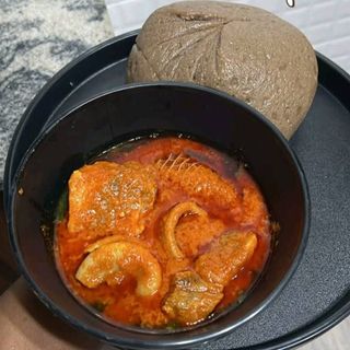 Amala served with ewedu mixed with Assorted titus pomo chicken