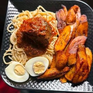 Boiled Sphaghetti served with plantains, titus fish and boiled egg