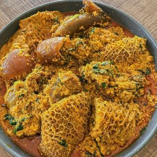 Egusi mixed with pomo shaki beef goatmeat and croaker fish