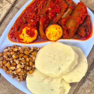 Sweet potatoes with oloyin beans served with assorted beef pomo and shaki mixed with 2 boiled eggs