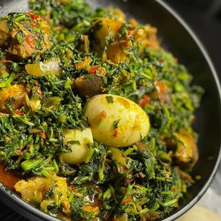 Eforiro mixed with Assorted and 1 boiled egg