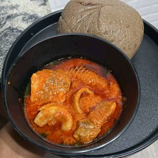 Amala served with ewedu mixed with Assorted beef pomo chicken and shaki