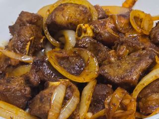 Goatmeat stirfried  in lots of spicy onions