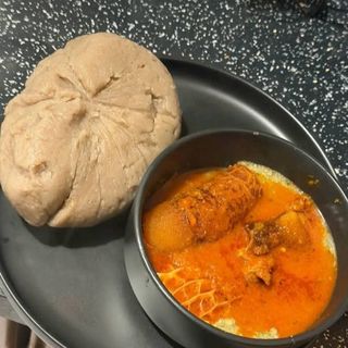 Amala served with okro mixed with pomo shaki and chicken