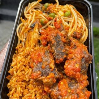 Jollof rice and Sphaghetti served with deep fried beef in peppered sauce