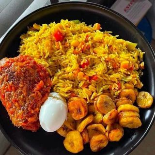 Fried Rice Plantains served with 1 piece of chicken and 1 boiled egg