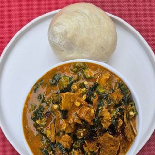 Ogbono mixed with okro and Assorted meat served with semolina