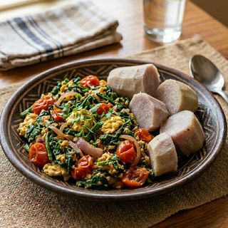 Kienyeji Greens mixed with Scrambled Kienyeji Eggs, Tomatoes & Onions, Boiled Nduma