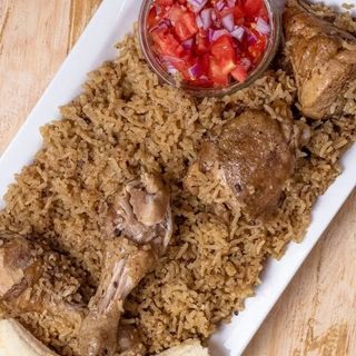 Kienyeji chicken with brown rice and kachumbari