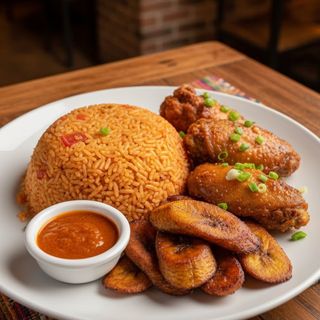 Jollof rice, wings, plantain and sauce