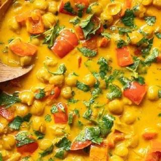 Jamaican style curry chickpeas with rice and peas , Callaloo Green mashed plantain and sweet plantain 