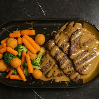 Медальоны из говядины с овощным гарниром