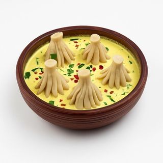 Хинкали с курицей в соусе Шкмерули (3 шт)