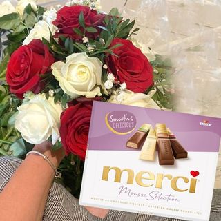 Bouquet of flowers with chocolate thanks
