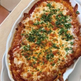 Escalope Milanaise de poulet à la pizzaoila