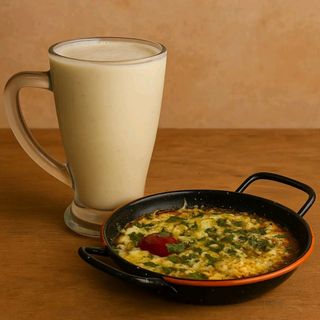 Mkila omelette tomate +jus de banane 