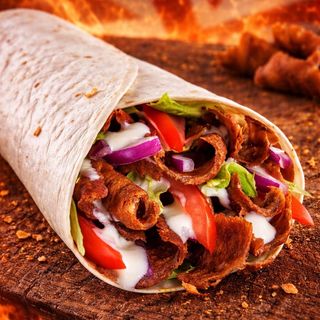 Mini beef doner wrap with salad and sauce 