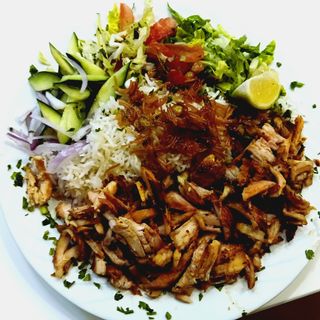 Chicken shawarma plate with rice and sauce