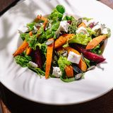 Салат с корнеплодами ,тыквенными семечками и козьем сыром