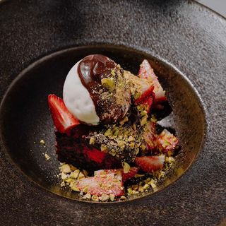Chocolate brownie with strawberries