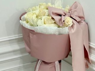 White roses with pink bow