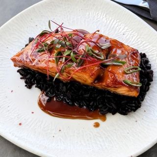 Salmon steak with wild rice and teriyaki sauce