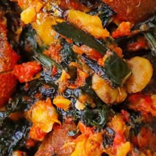 Efo Riro With Kpomo And Smoked Fish