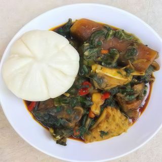 Vegetable soup + pounded yam + beef + water