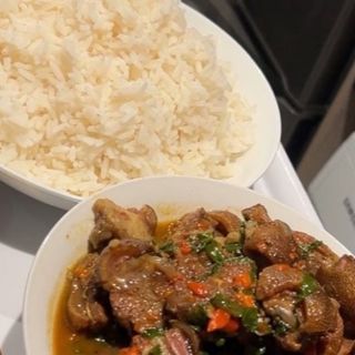 Whiterice and goatmeat pepper soup