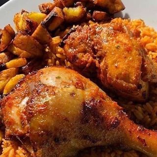 Jollof rice chicken and plantains 