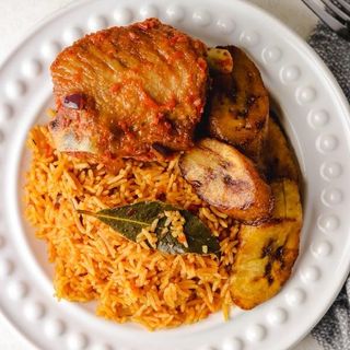 Jollof and Fried Rice served along with Turkey and plantain