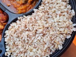 Ofada rice with sauce , Egg ponmo and beef