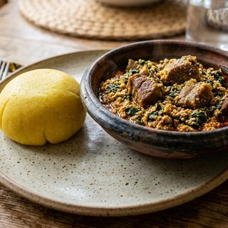 One Rap of eba with Egusi soup and fried beef