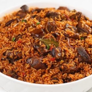 Asun rice + plantain + chicken