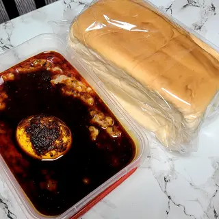 EwaAgonyin with egg and bread