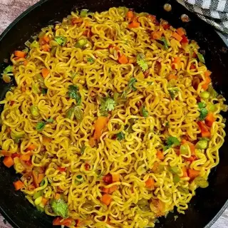 Spicy Noodles Served With Fried Egg