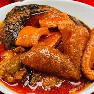 Pomo and Shaki Mixed with Titus Fish in Peppered Stew