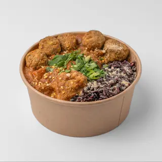 Black rice with butter tofu sauce and kale balls