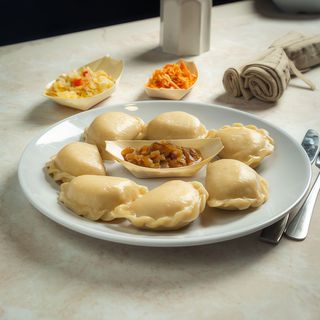 Pierogi z kapustą i grzybami z cebulką