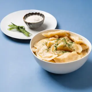 Pierogi z ziemniakami i pieczarkami (12 szt.)