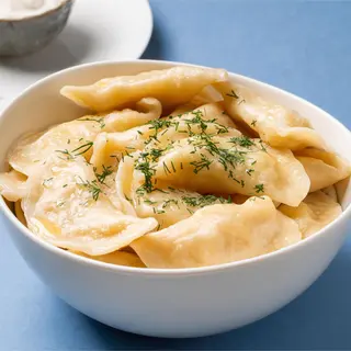 Pierogi z kapustą kiszoną i smażonymi grzybami 12 szt.