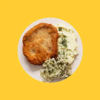 Kotlet schabowy z puree ziemniaczanym i kapustą zasmażaną