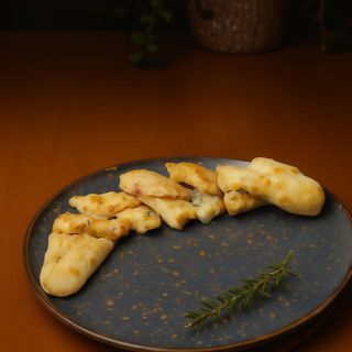 Enroladinho de alho e bacon 