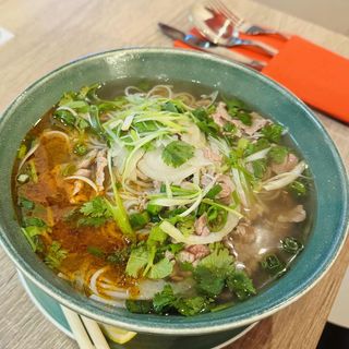 Beef noodle soup with sate