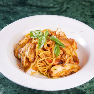 Seafood spaghetti with red sauce and basil