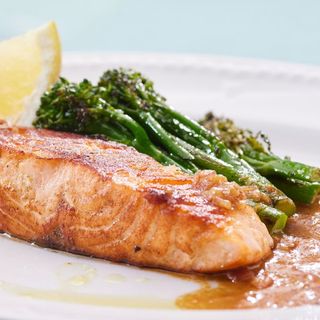 Grilled salmon with butter sauce and broccolini