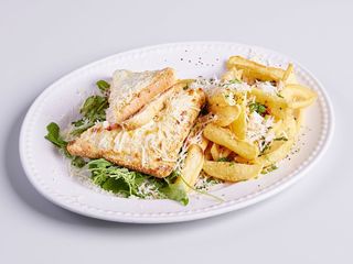 Croque monsieur with french fries, thyme and parmesan