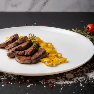 Straccetti de vită cu tagliatelle al tartufo - 200/200 gr